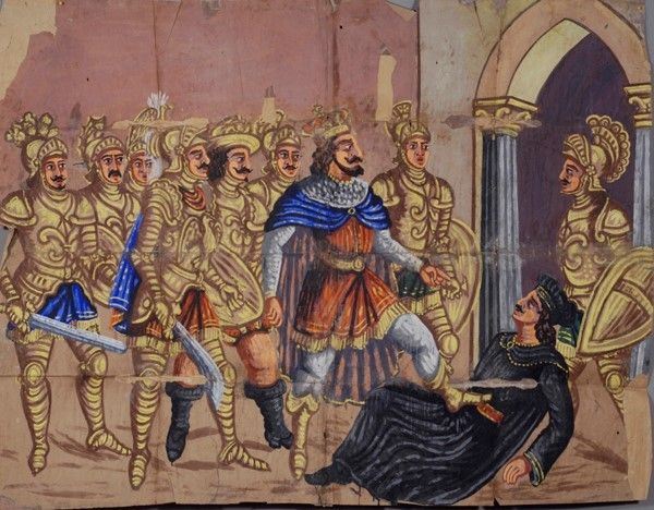 Carlo alla presenza dei paladini dà un calcio ai Malagigi