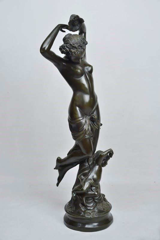 Female nude with flowers and putto