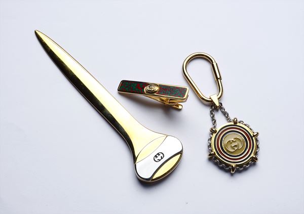 GUCCI - Un tagliacarte, un portachiavi e un ferma cravatta