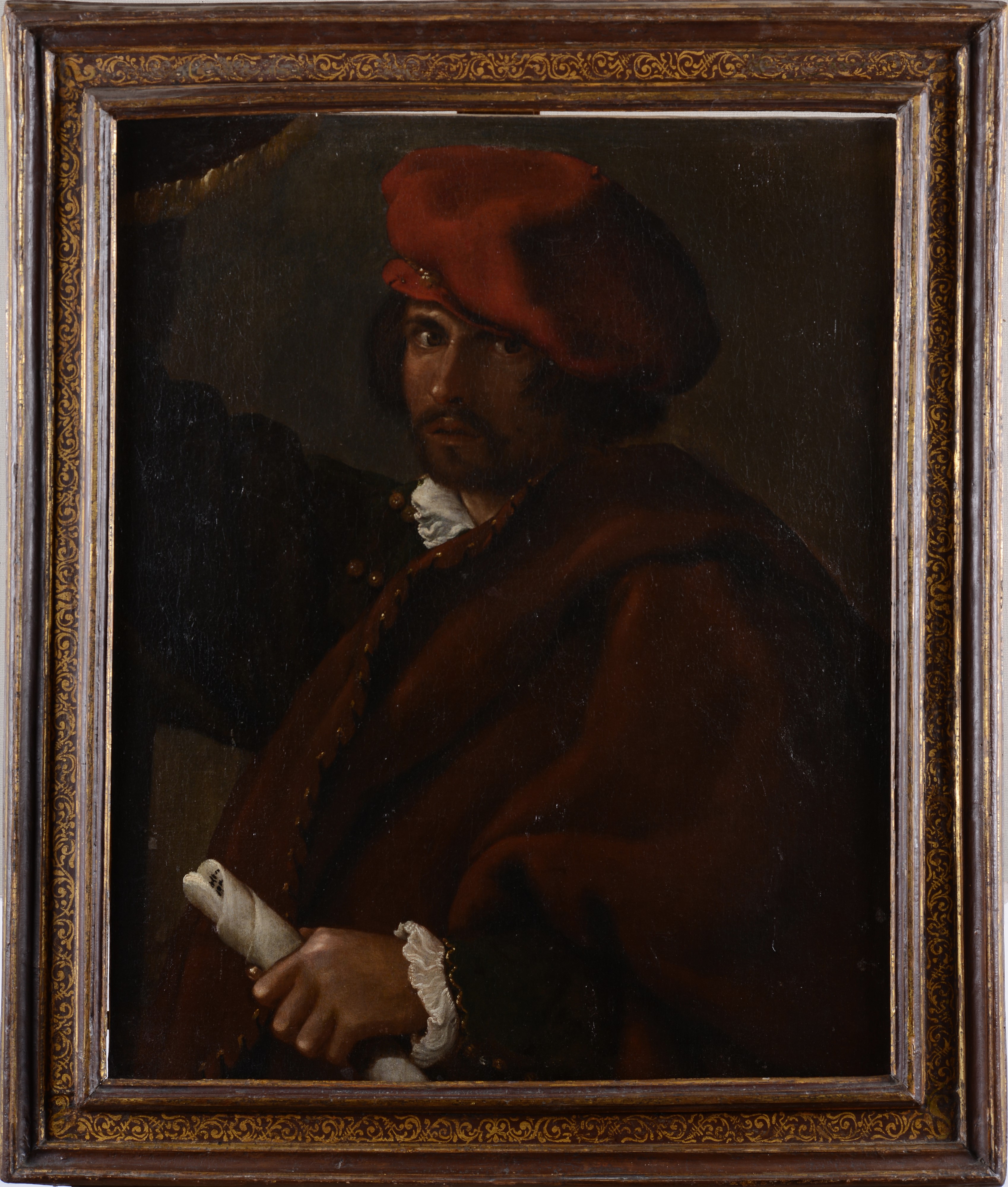 Ritratto di uomo con berretto rosso