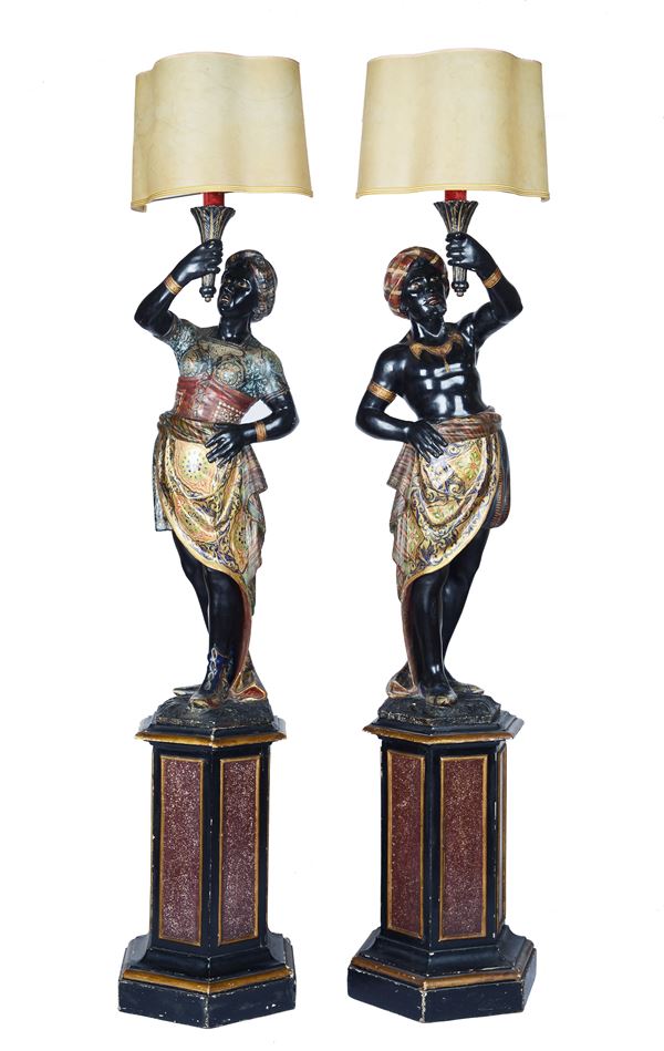 Pair of Moors holding torches