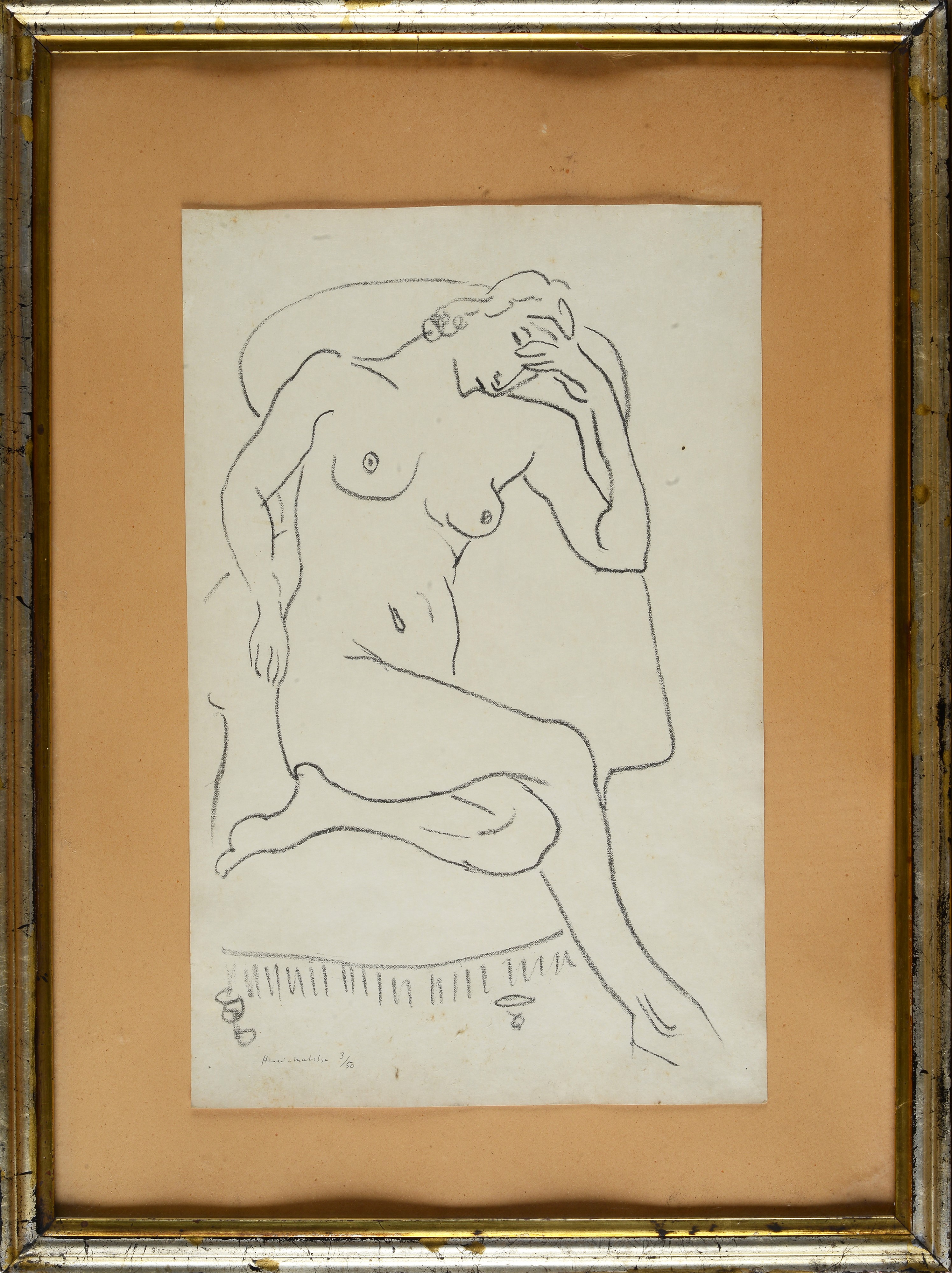 Nu assis dans un fauteuil, une jambe replié